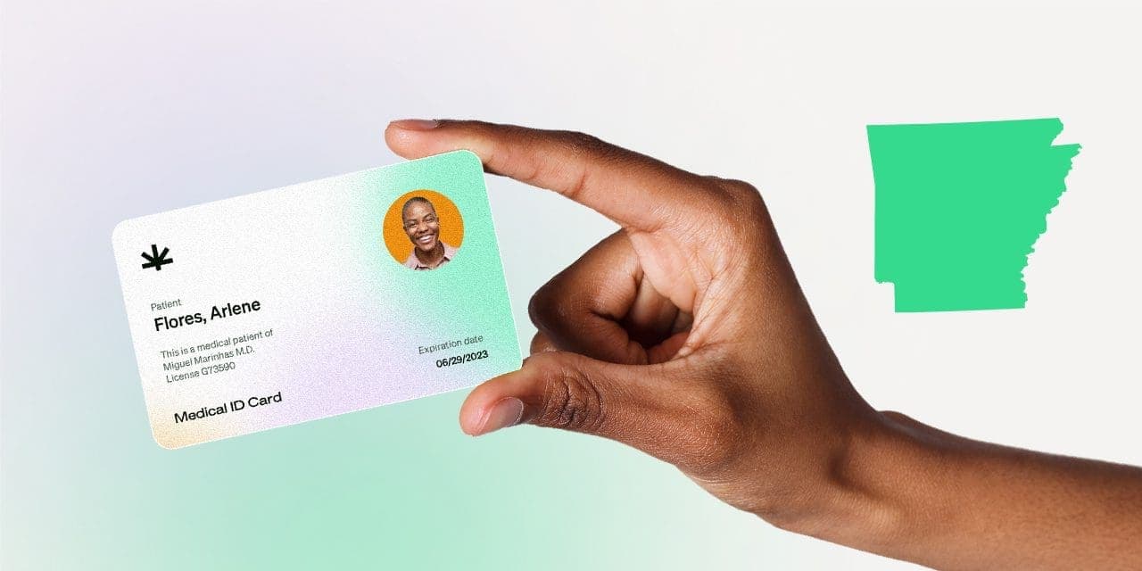 closeup hand holding MMJ card
